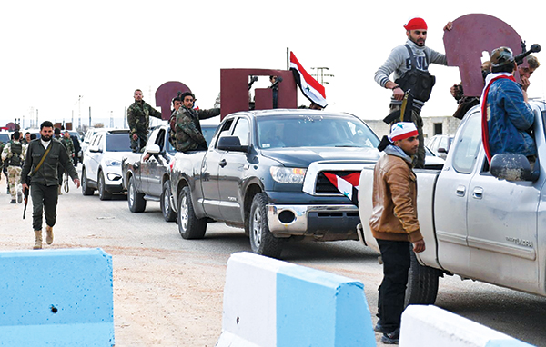  Đoàn xe chở lực lượng ủng hộ Chính phủ Syria tiến đến Afrin hôm 20-2. Ảnh: AFP