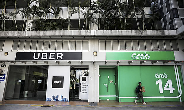 Văn phòng Uber và Grab tại Singapore. Ảnh: Reuters