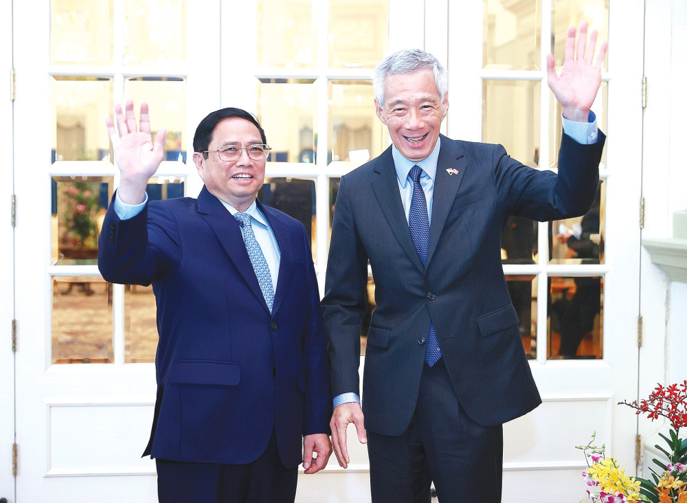 Thủ tướng Phạm Minh Chính hội đàm với Thủ tướng Lý Hiển Long Thủ tướng Phạm Minh Chính và Thủ tướng Singapore Lý Hiển Long chụp ảnh chung. Ảnh: Dương Giang-TTXVN