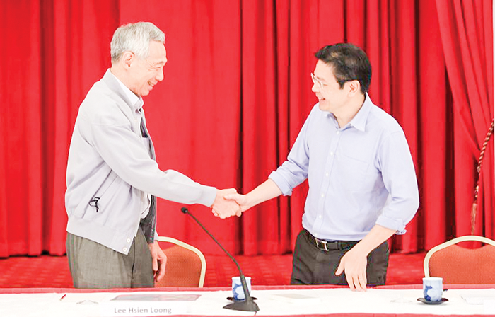 Thủ tướng Lý Hiển Long (trái) và Phó Thủ tướng Lawrence Wong.